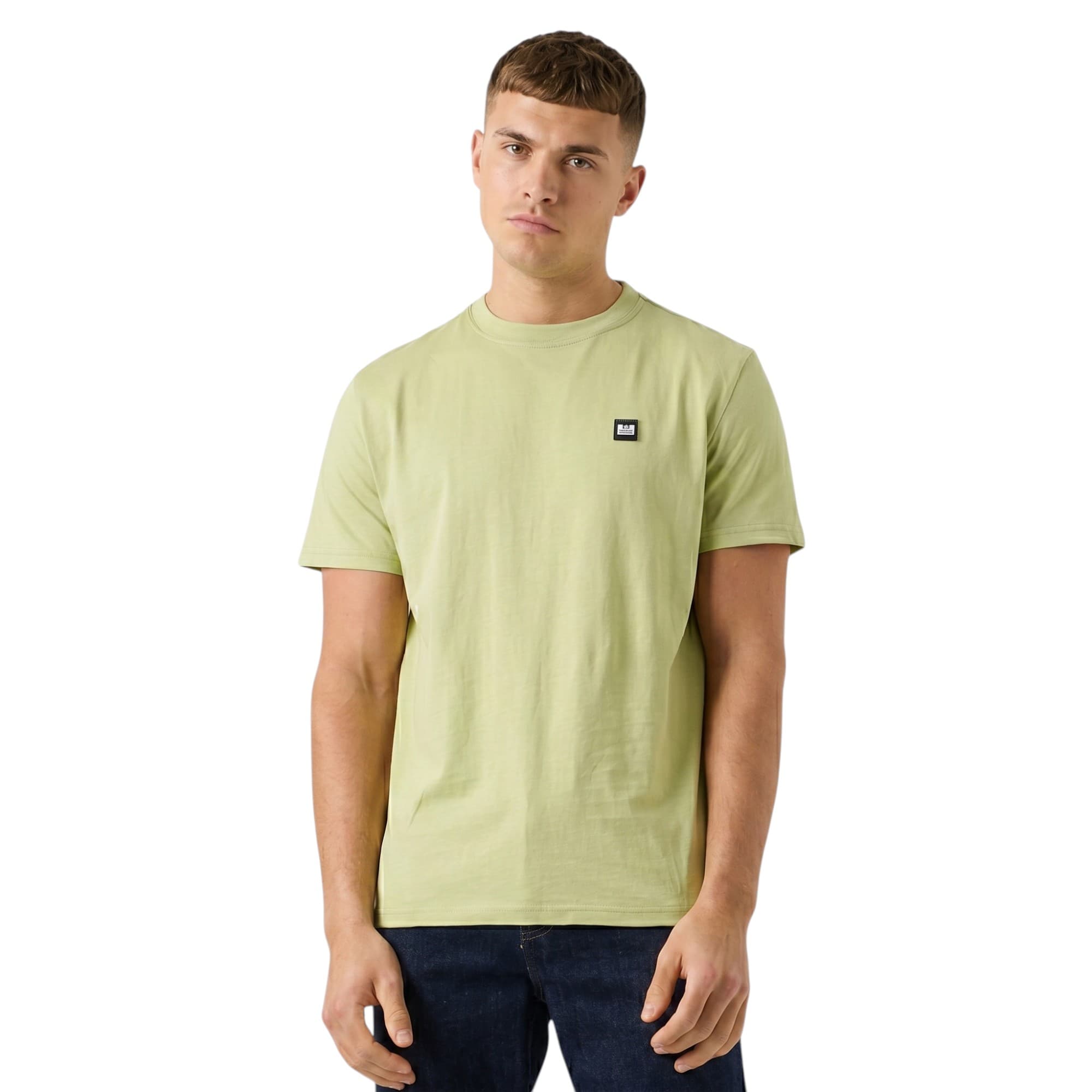 Weekend Offender pale green cotton t-shirt front view with chest badge